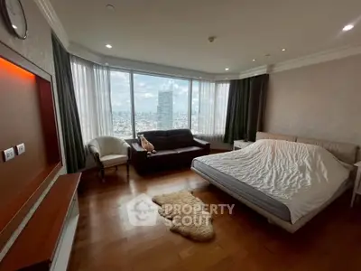 Spacious bedroom with city view and elegant furnishings