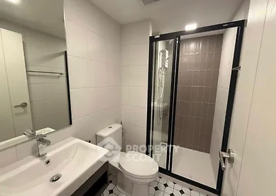 Modern bathroom with sleek shower enclosure and stylish fixtures