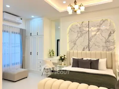 Luxurious bedroom with elegant decor and modern lighting