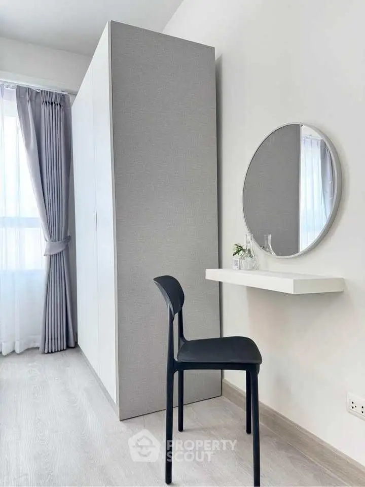 Modern minimalist bedroom with sleek furniture and natural light