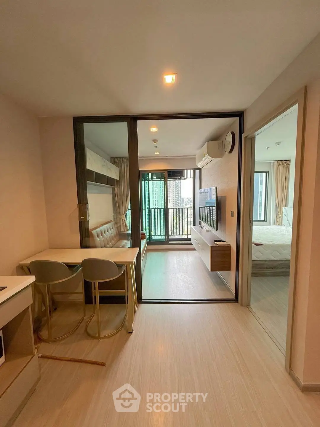 Modern apartment interior with open layout and balcony view