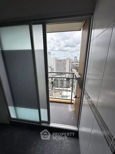 Modern balcony with city view from high-rise apartment