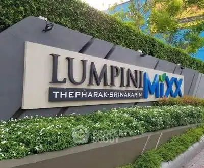 Lush green entrance of Lumpini Mixx Thepharak-Srinakarin with modern signage.