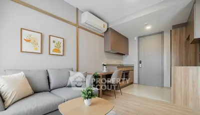 Modern living room with stylish decor and open kitchen layout