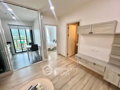 Modern apartment interior with open layout, featuring a cozy living area, stylish kitchen, and scenic balcony view.