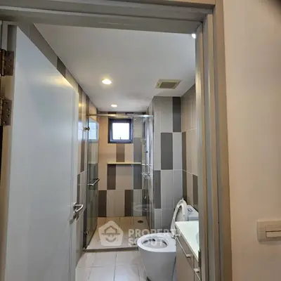 Modern bathroom with sleek design and glass shower enclosure