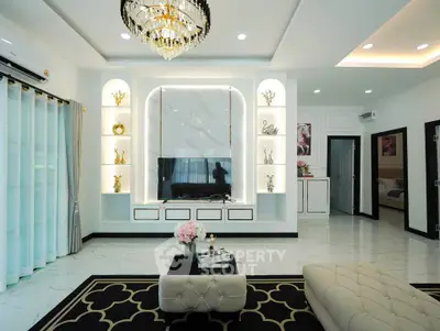 Luxurious modern living room with elegant chandelier and stylish decor
