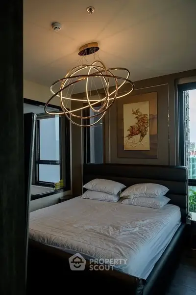 Luxurious bedroom with modern lighting and elegant decor in a high-end apartment.