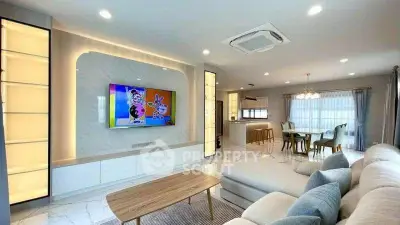 Spacious modern living room with elegant decor and open layout, featuring a cozy seating area and dining space.