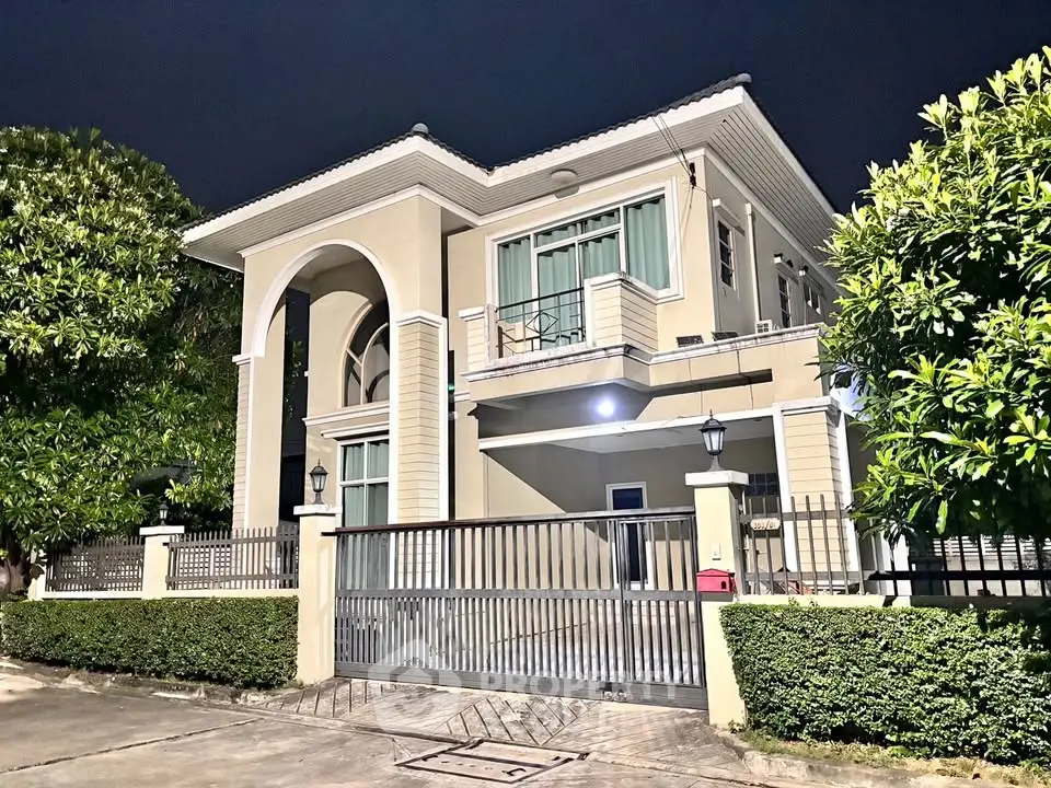 Stunning two-story modern house with elegant facade and lush greenery, perfect for luxurious living.