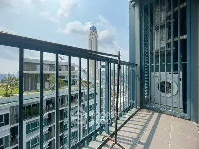 Modern balcony with city view and washing machine in high-rise apartment