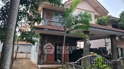 Charming two-story house with spacious balcony and lush garden