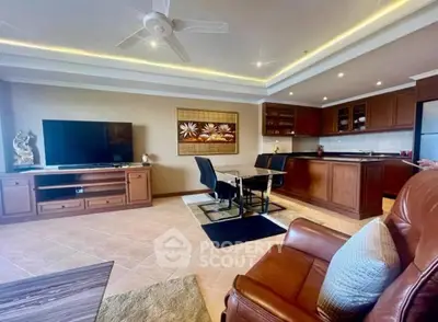 Spacious living room with modern decor and open kitchen layout