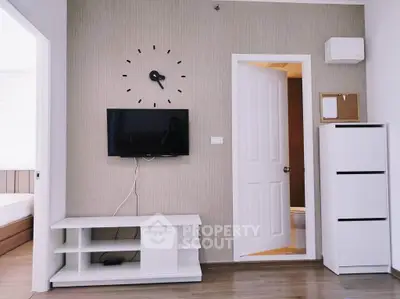 Modern living room with wall-mounted TV and stylish decor