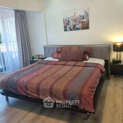 Spacious bedroom with elegant decor and natural light