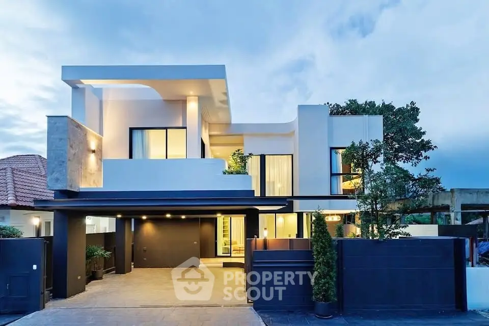 Modern luxury home with sleek architecture and spacious driveway, perfect for contemporary living.
