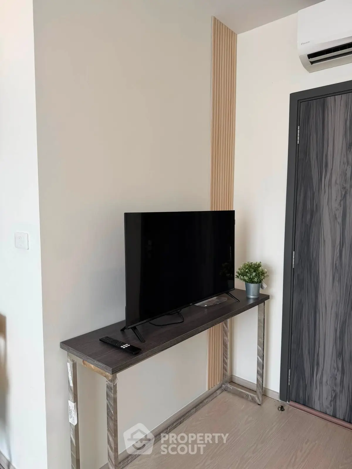 Modern living room corner with sleek TV setup and stylish decor