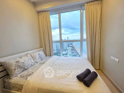 Cozy bedroom with stunning city and ocean view from large window