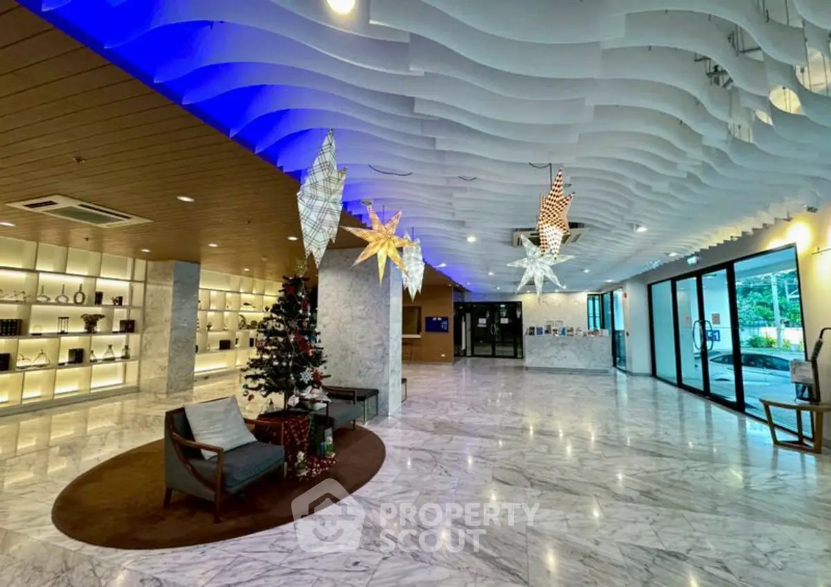 Luxurious building entrance with modern decor and festive ambiance