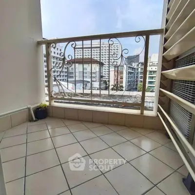 Charming balcony with city view and decorative railing in urban apartment