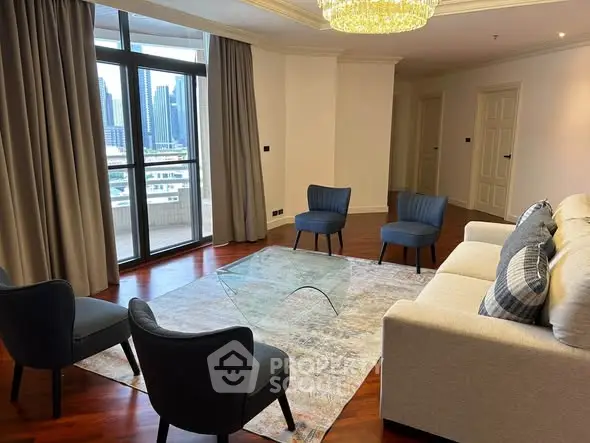 Elegant living room with city view, featuring modern furniture and large windows for natural light.