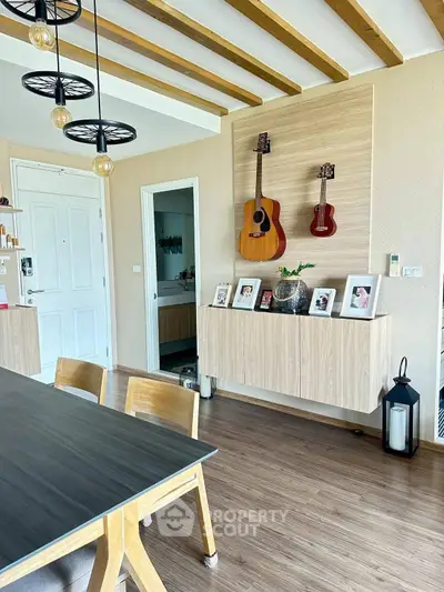 Chic dining area with wooden accents and musical decor, perfect for modern living.
