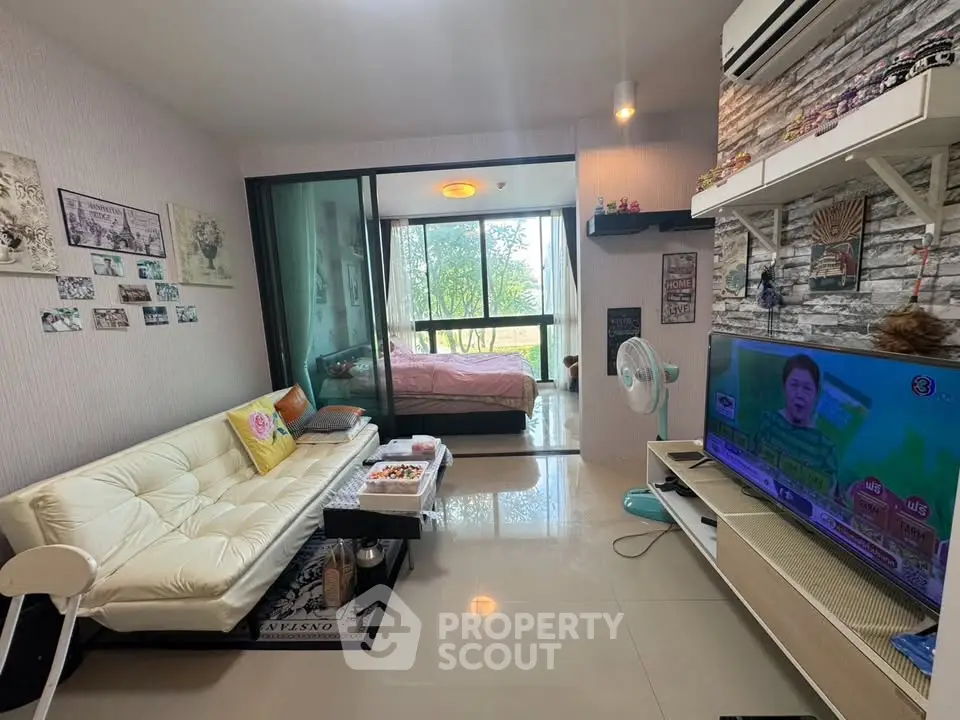 Modern living room with open view to bedroom and stylish decor