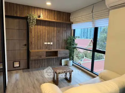 Modern living room with wooden accents and large window view