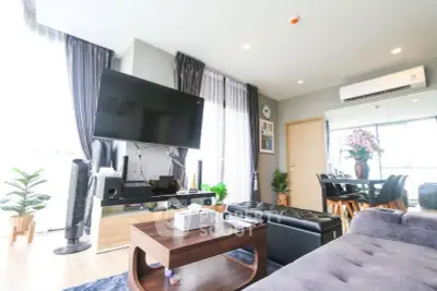 Spacious modern living room with large TV and elegant decor