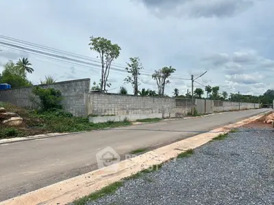 Spacious plot with boundary wall, ideal for development in a serene location.
