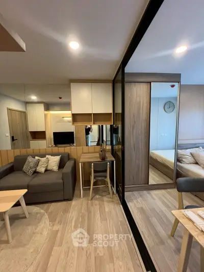 Modern living room with stylish decor and cozy seating area in a contemporary apartment.