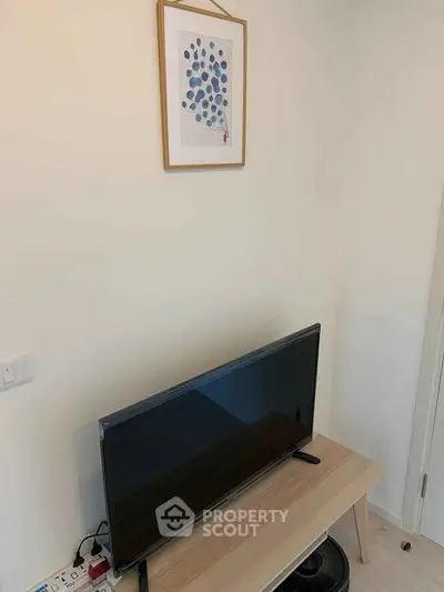 Modern living room corner with TV and minimalist decor