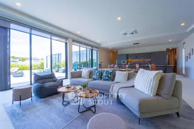Spacious modern living room with open layout and stylish decor, perfect for entertaining.