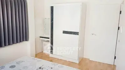 Modern bedroom with sleek wardrobe and vanity in minimalist design