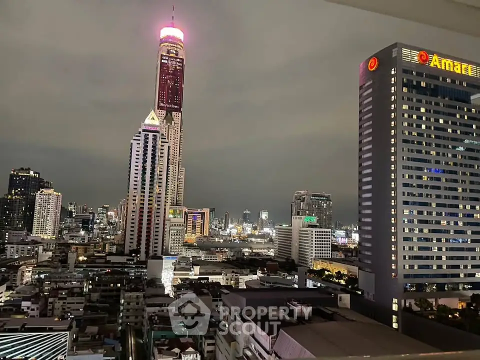 Stunning cityscape view featuring illuminated skyscrapers and vibrant urban skyline at night.