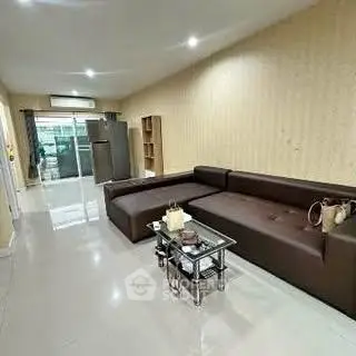 Spacious living room with modern sofa and glass coffee table