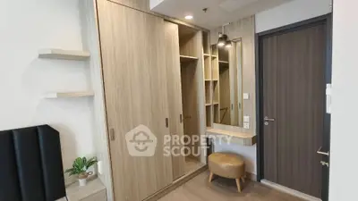 Modern bedroom with stylish wooden wardrobe and vanity area