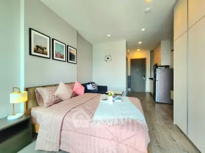 Modern bedroom with stylish decor and cozy ambiance in a contemporary apartment.