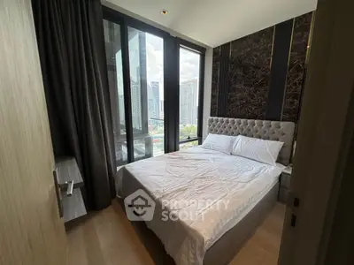 Luxurious bedroom with stunning city view and elegant decor