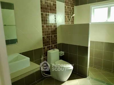 Modern bathroom with stylish tiles and natural light