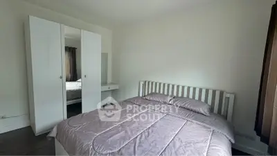 Cozy bedroom with modern white furniture and soft lighting