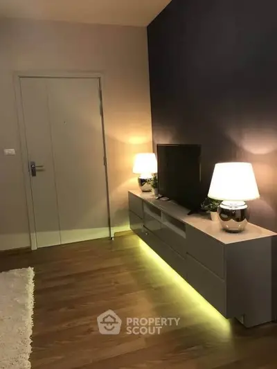 Modern living room with stylish lighting and sleek furniture