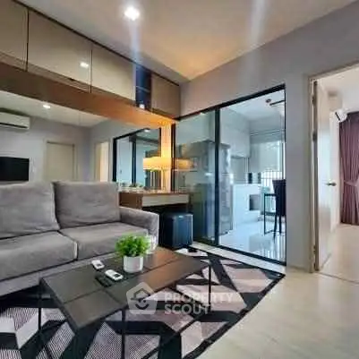 Modern living room with stylish decor and open kitchen layout