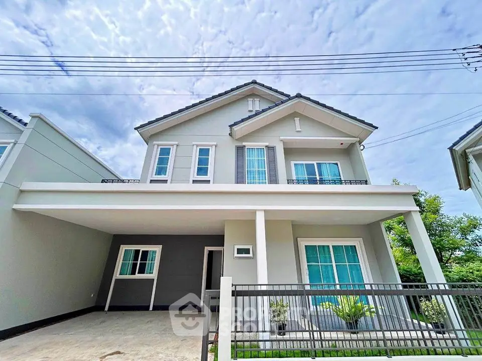Modern two-story house with spacious driveway and stylish facade