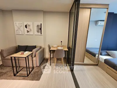 Modern studio apartment with cozy living area and stylish bedroom
