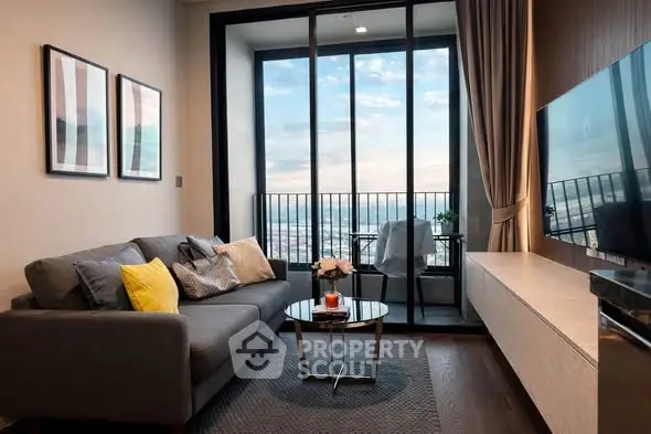 Modern living room with balcony and stunning city view, featuring stylish decor and comfortable seating.