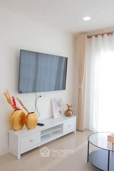Modern living room with wall-mounted TV and elegant decor