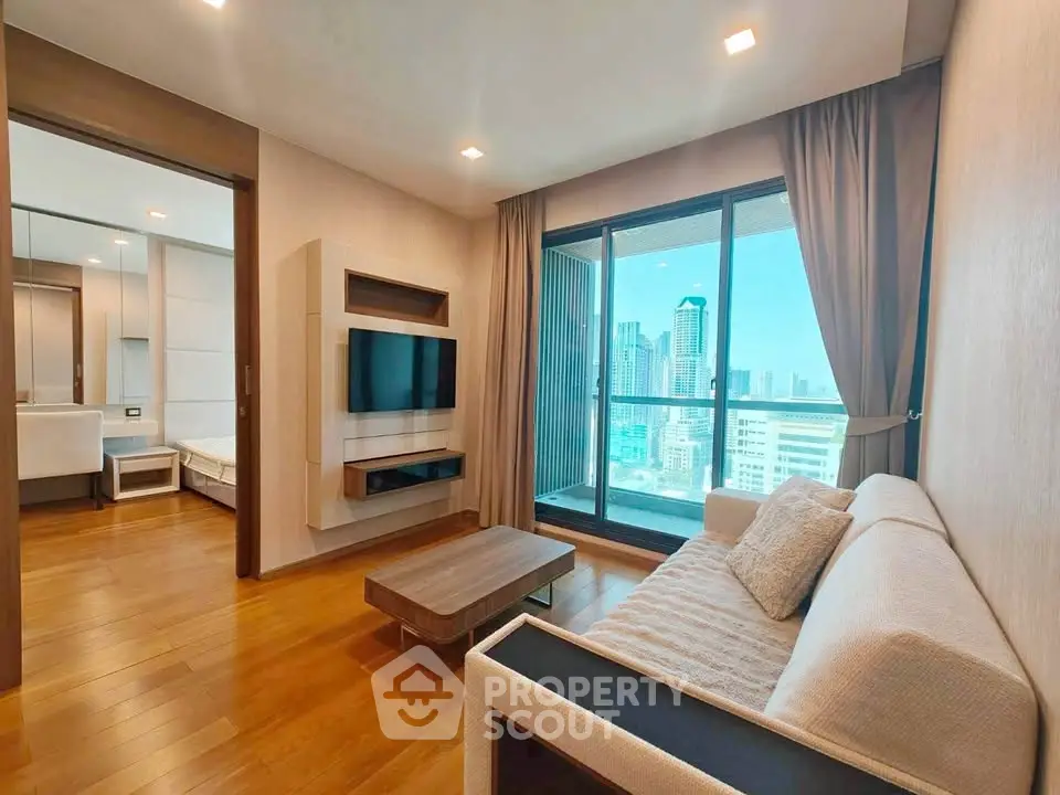 Modern living room with city view, featuring sleek furniture and wooden flooring, perfect for urban living.