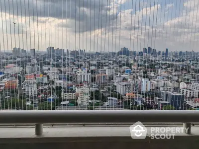 Stunning cityscape view from high-rise balcony with panoramic skyline