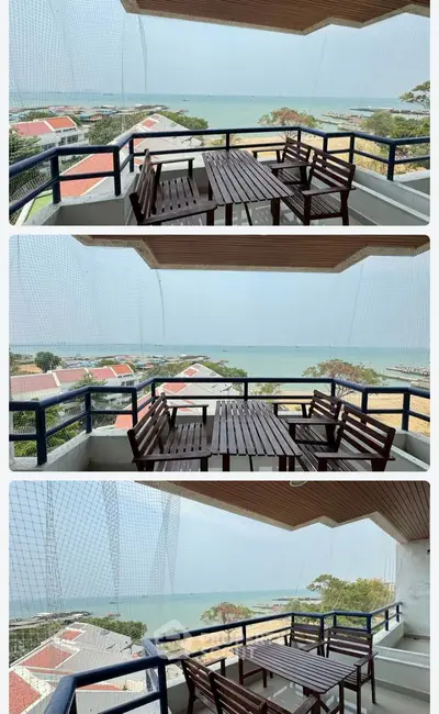 Stunning balcony with panoramic sea view and outdoor seating, perfect for relaxation and enjoying the scenery.